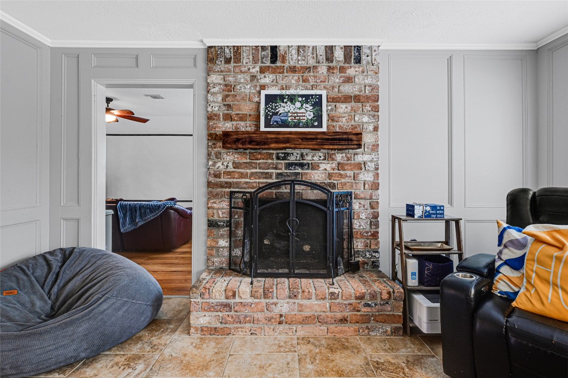 5322 Ashmere Lane Spring, TX 77379 - Photo 7 of 17 Open living room with cozy fireplace and stunning views of the backyard pool, creating the perfect indoor-outdoor feel.