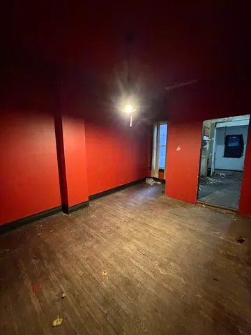 a bathroom with a toilet and shower