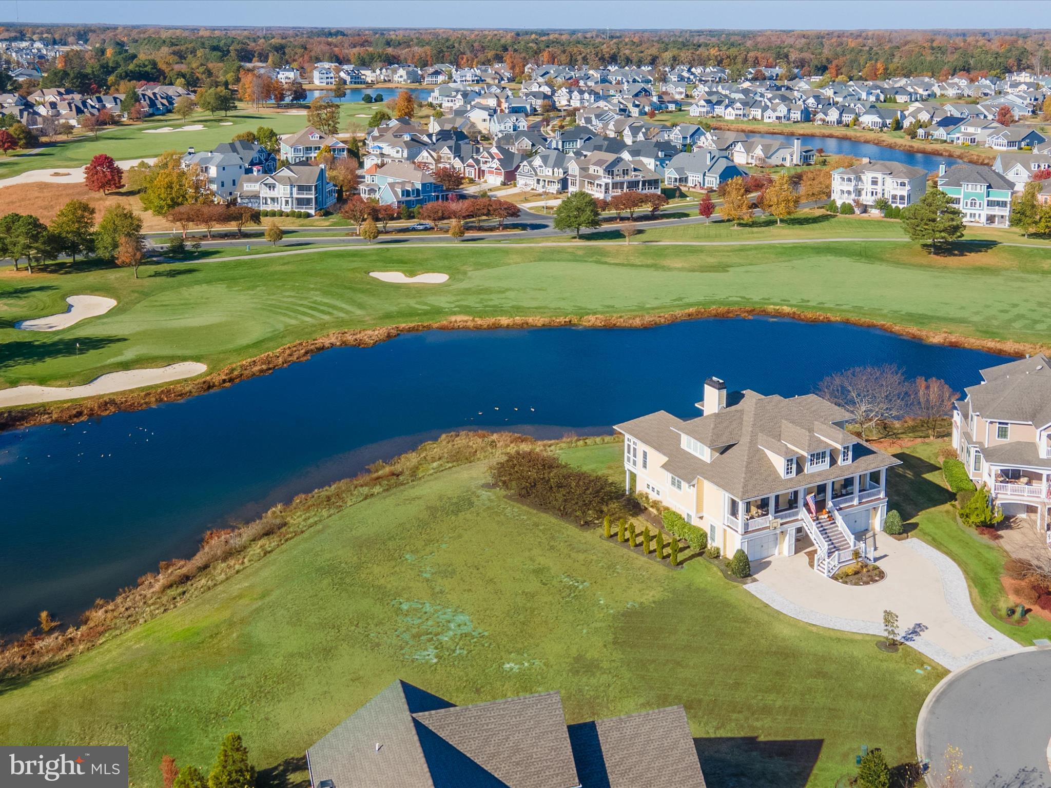 33473 Islander Drive Millsboro, DE 19966 - Photo 2 of 10 a view of a golf course with an ocean view