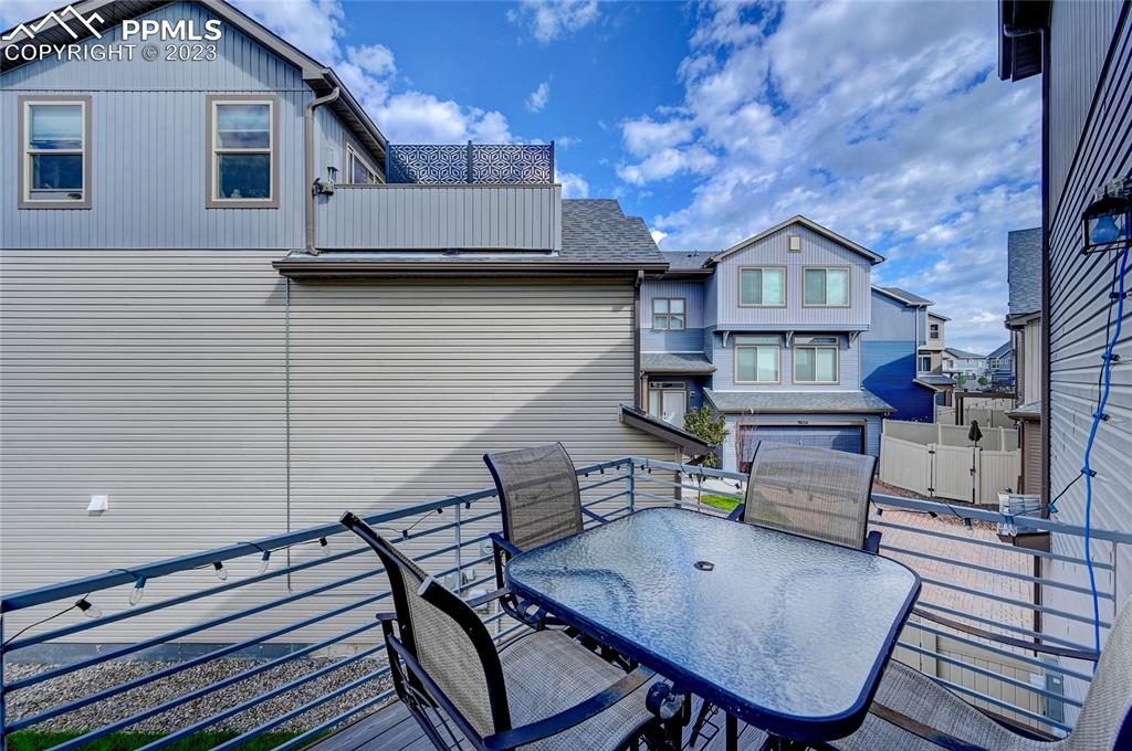 9642 Timberlake Loop Colorado Springs, CO 80927 - Photo 19 of 46 a backyard of a house with barbeque oven table and chairs