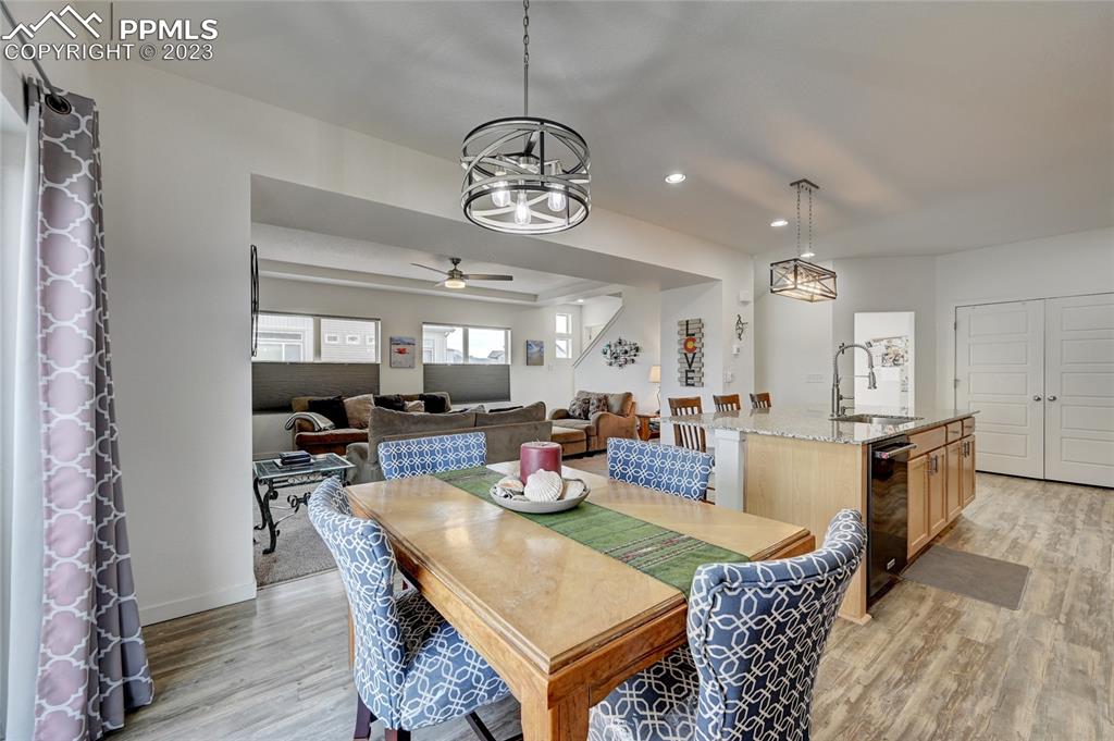 9642 Timberlake Loop Colorado Springs, CO 80927 - Photo 22 of 46 a view of a dining room with furniture window and wooden floor
