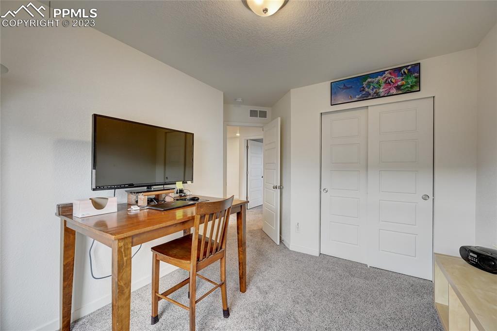 9642 Timberlake Loop Colorado Springs, CO 80927 - Photo 35 of 46 a table and chairs in a room