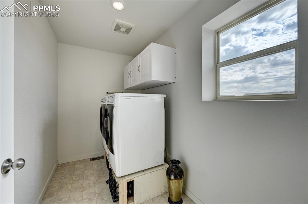 9642 Timberlake Loop Colorado Springs, CO 80927 - Photo 39 of 46 a utility room with dryer and washer