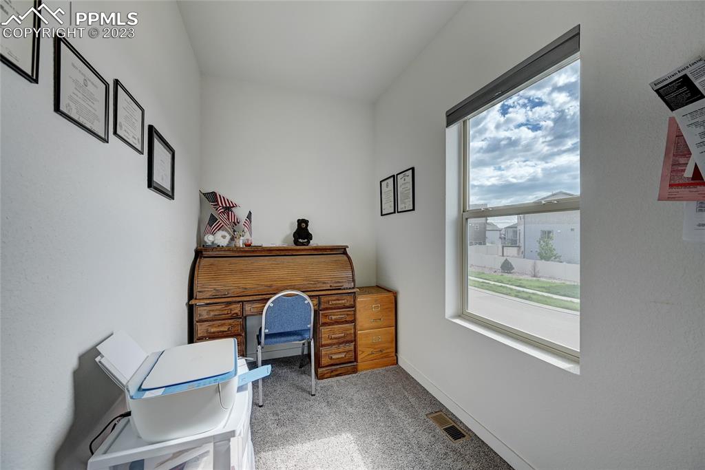 9642 Timberlake Loop Colorado Springs, CO 80927 - Photo 40 of 46 a living room with furniture and a window