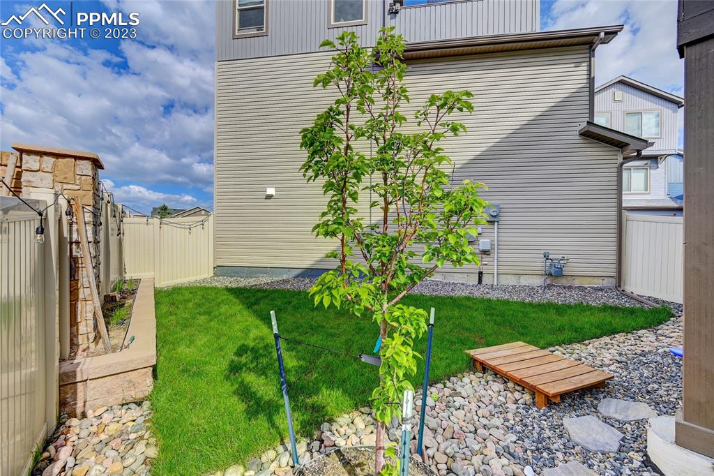 9642 Timberlake Loop Colorado Springs, CO 80927 - Photo 43 of 46 a view of a yard with plants and wooden fence