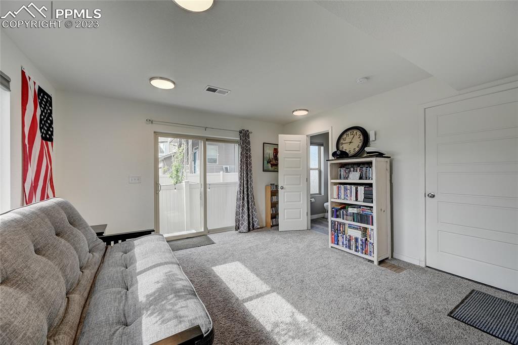 9642 Timberlake Loop Colorado Springs, CO 80927 - Photo 8 of 46 a living room with furniture and window