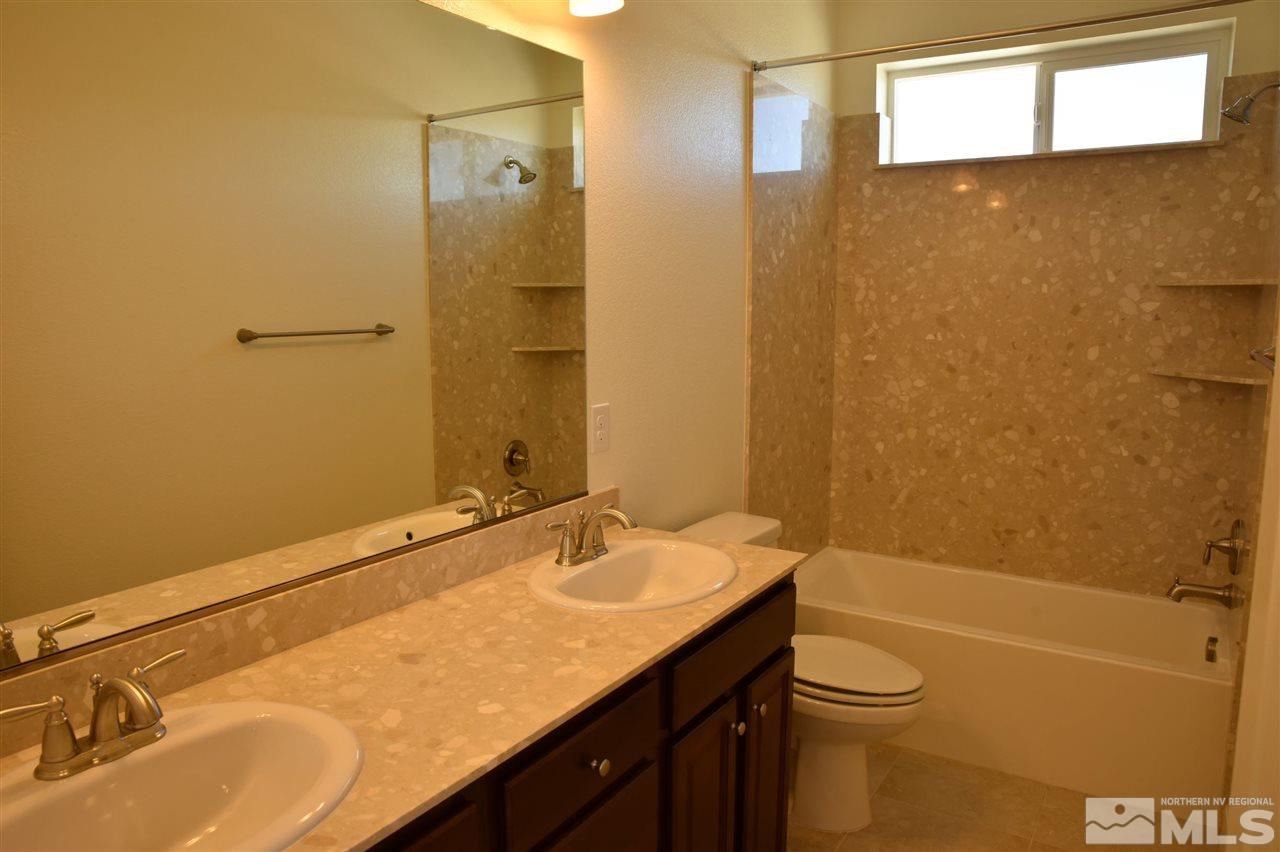 3080 Bull Rider Drive Reno, NV 89521 - Photo 20 of 21 a bathroom with a sink and a mirror