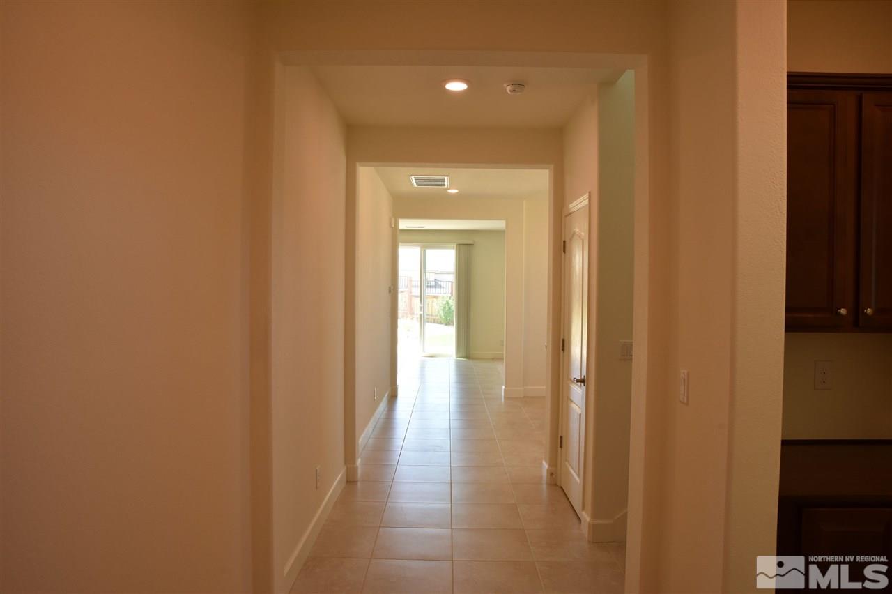 3080 Bull Rider Drive Reno, NV 89521 - Photo 3 of 21 a view of a hallway with wooden floor