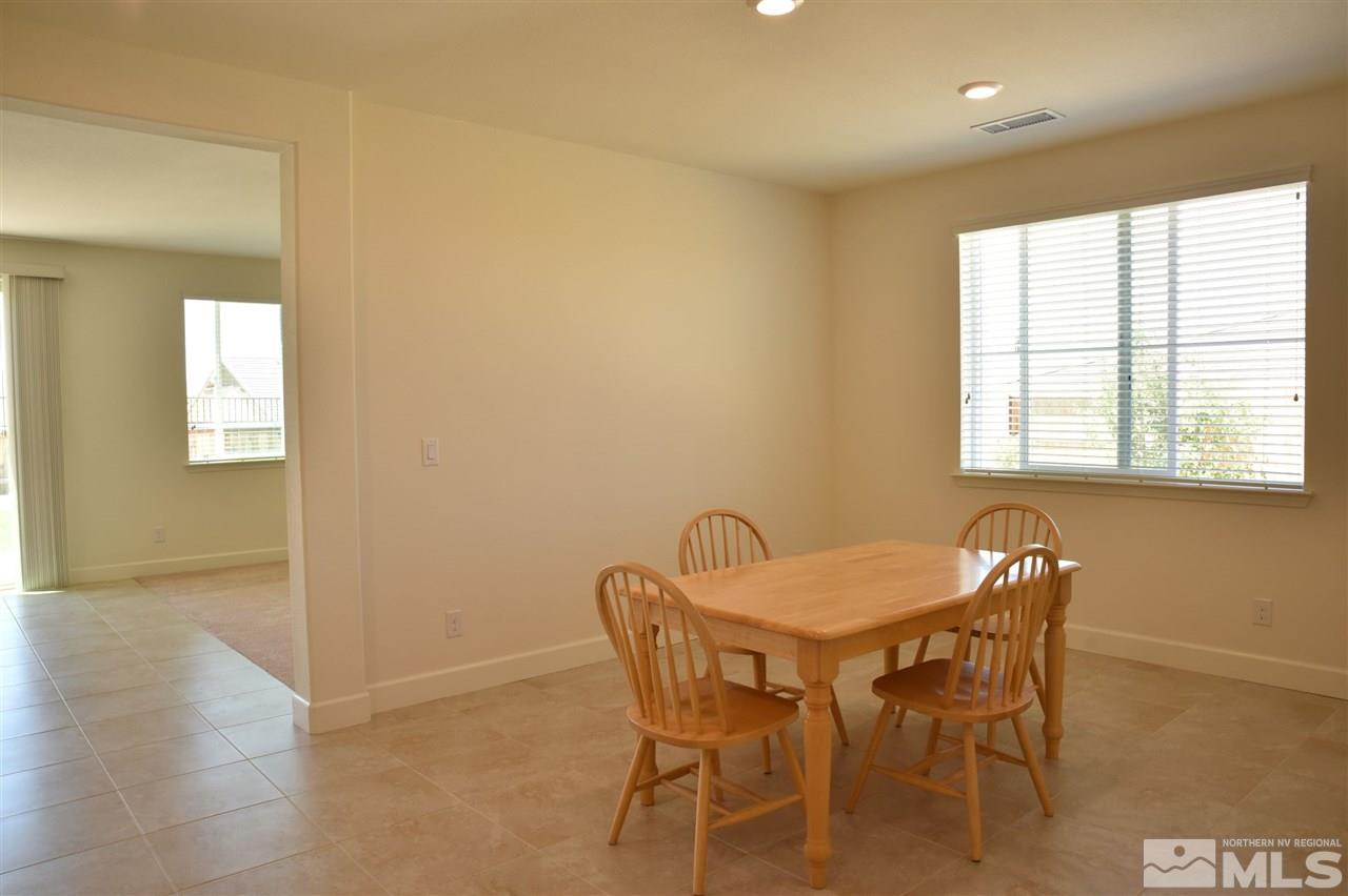 3080 Bull Rider Drive Reno, NV 89521 - Photo 7 of 21 a dining room with furniture and window