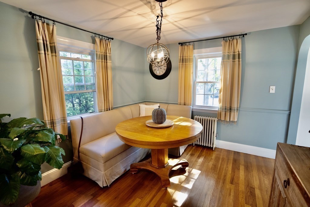 56 Bellows Circle Abington, MA 02351 - Photo 11 of 42 a view of a dining room with furniture window and wooden floor