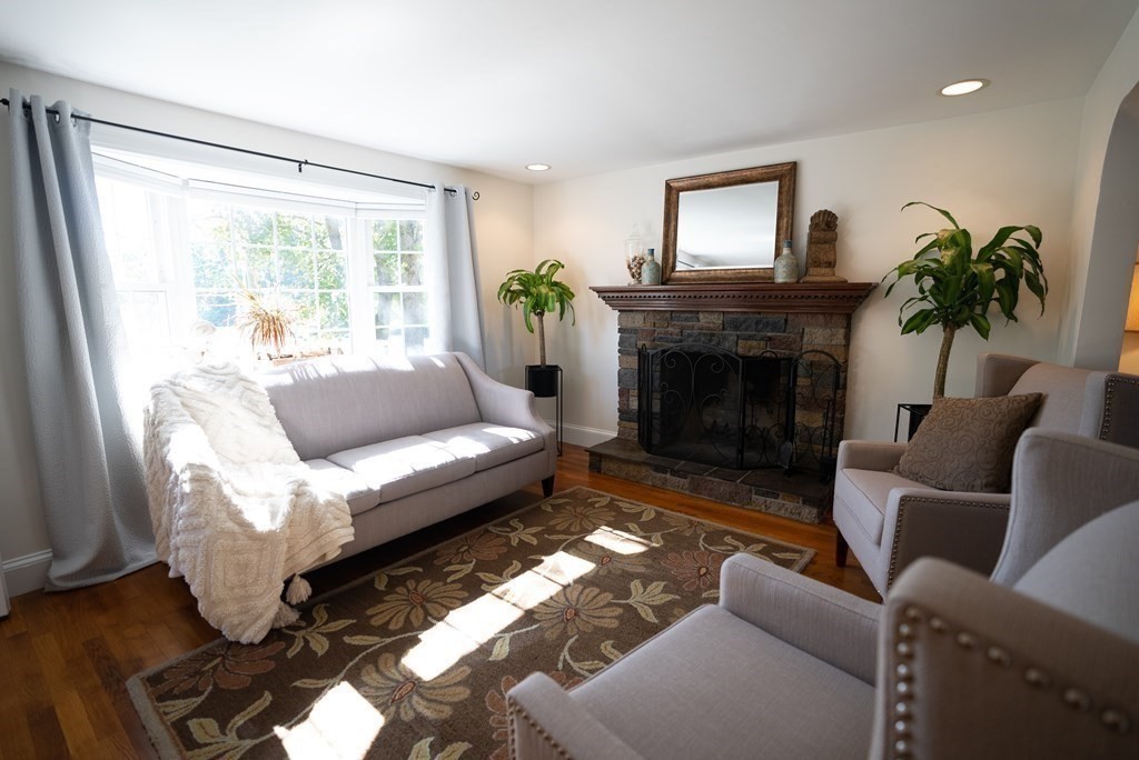 56 Bellows Circle Abington, MA 02351 - Photo 12 of 42 a living room with furniture and a fireplace