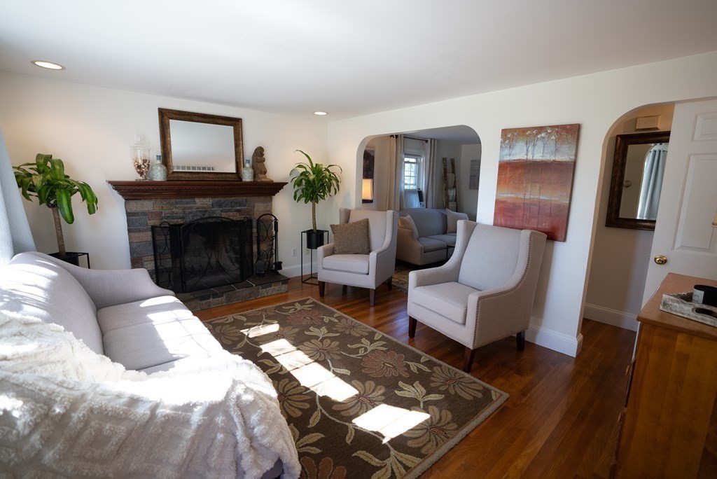 56 Bellows Circle Abington, MA 02351 - Photo 13 of 42 a living room with furniture and a fireplace