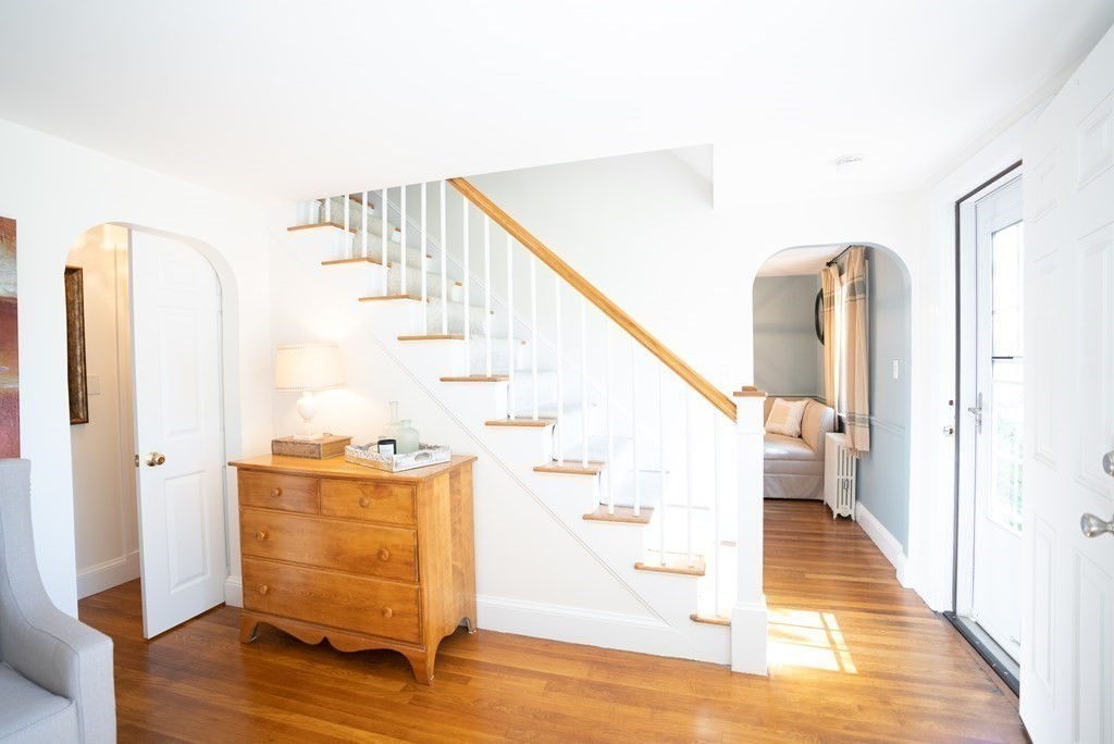56 Bellows Circle Abington, MA 02351 - Photo 16 of 42 a view of entryway and kitchen with wooden floor