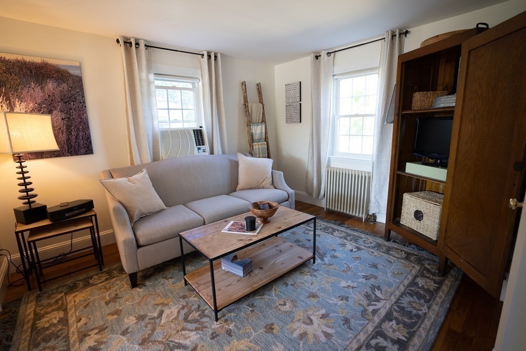 56 Bellows Circle Abington, MA 02351 - Photo 18 of 42 a living room with furniture and a window