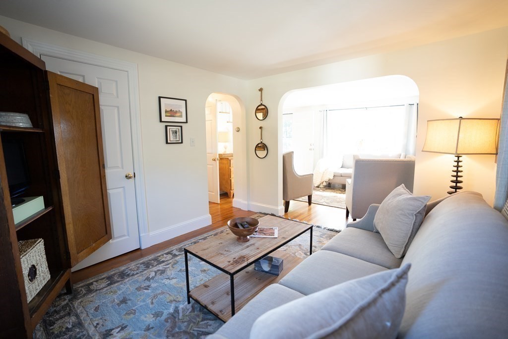 56 Bellows Circle Abington, MA 02351 - Photo 19 of 42 a living room with furniture a rug and a window