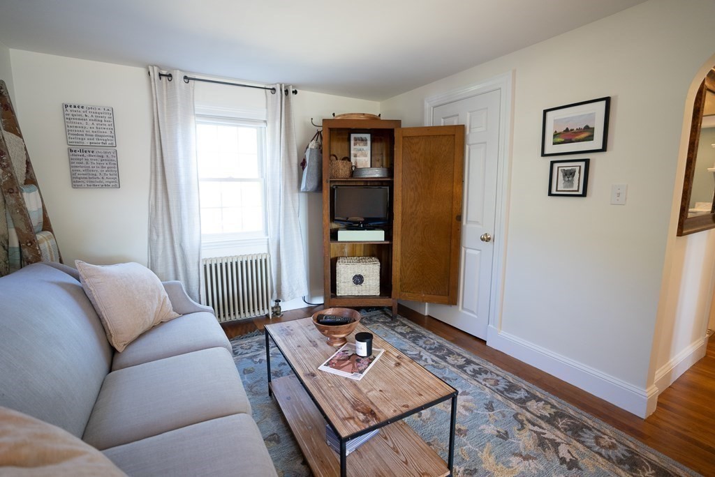56 Bellows Circle Abington, MA 02351 - Photo 20 of 42 a living room with furniture and wooden floor