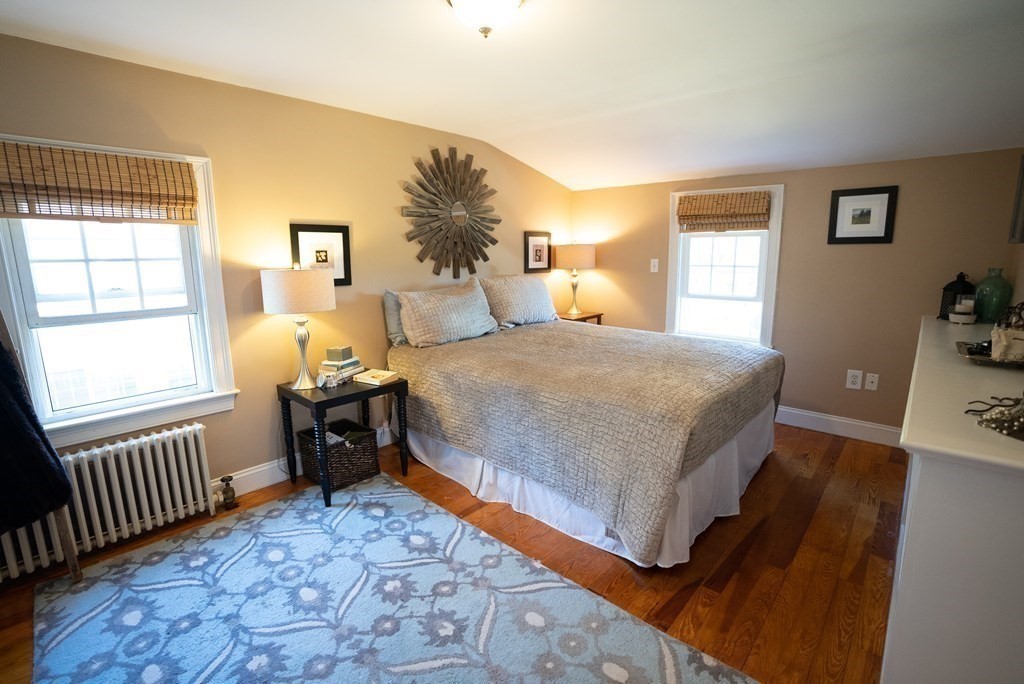 56 Bellows Circle Abington, MA 02351 - Photo 23 of 42 a bedroom with a bed and a window