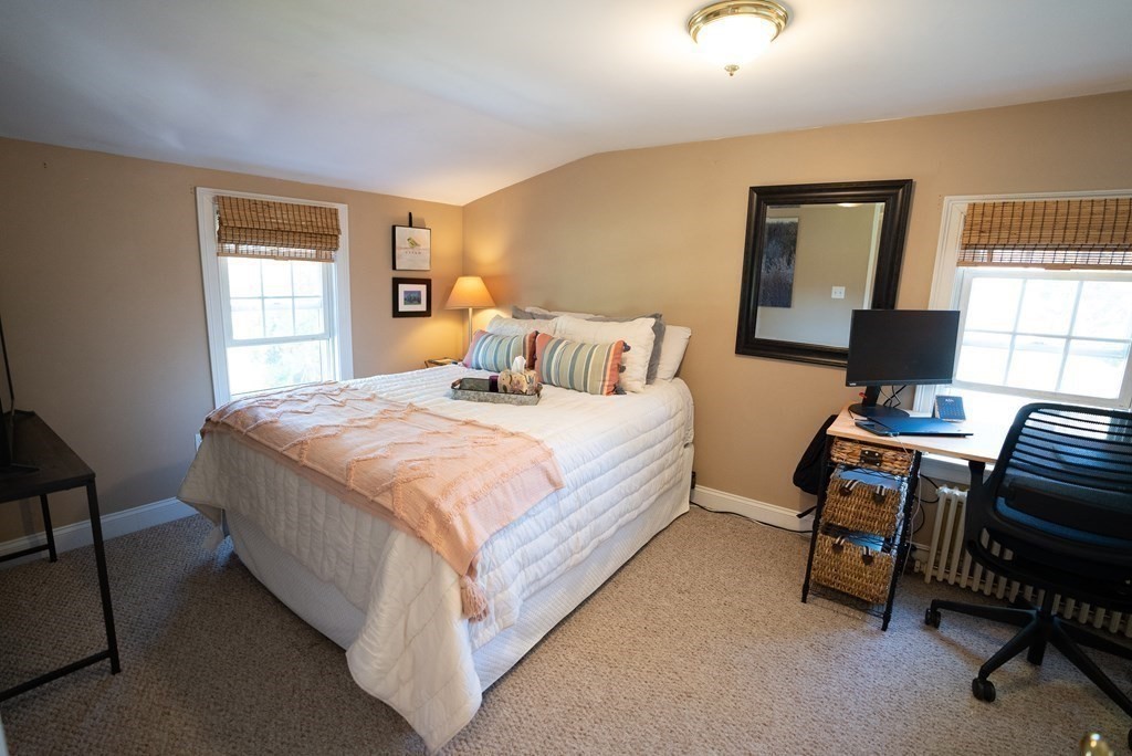 56 Bellows Circle Abington, MA 02351 - Photo 25 of 42 a bedroom with a bed and a window