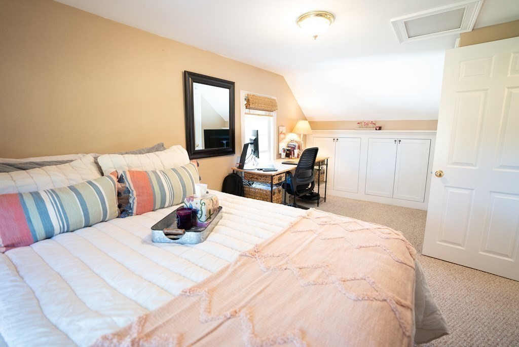 56 Bellows Circle Abington, MA 02351 - Photo 26 of 42 a bedroom with a bed and wooden floor