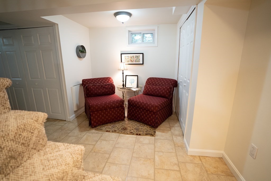 56 Bellows Circle Abington, MA 02351 - Photo 33 of 42 a living room with furniture and a window