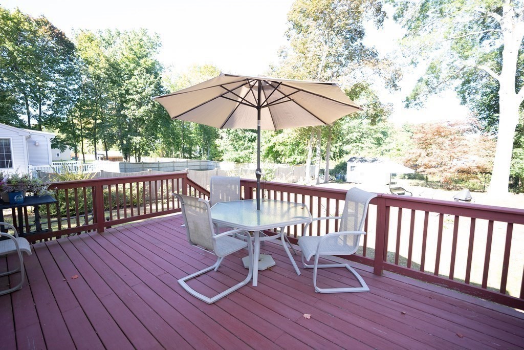 56 Bellows Circle Abington, MA 02351 - Photo 36 of 42 a view of a deck with furniture and wooden floor