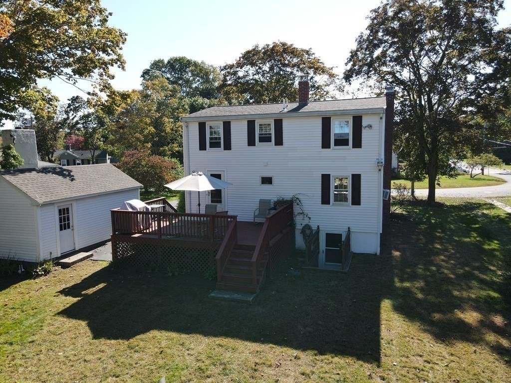 56 Bellows Circle Abington, MA 02351 - Photo 4 of 42 a view of a backyard with sitting area