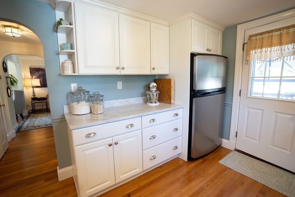 56 Bellows Circle Abington, MA 02351 - Photo 6 of 42 a kitchen with stainless steel appliances a refrigerator sink and cabinets