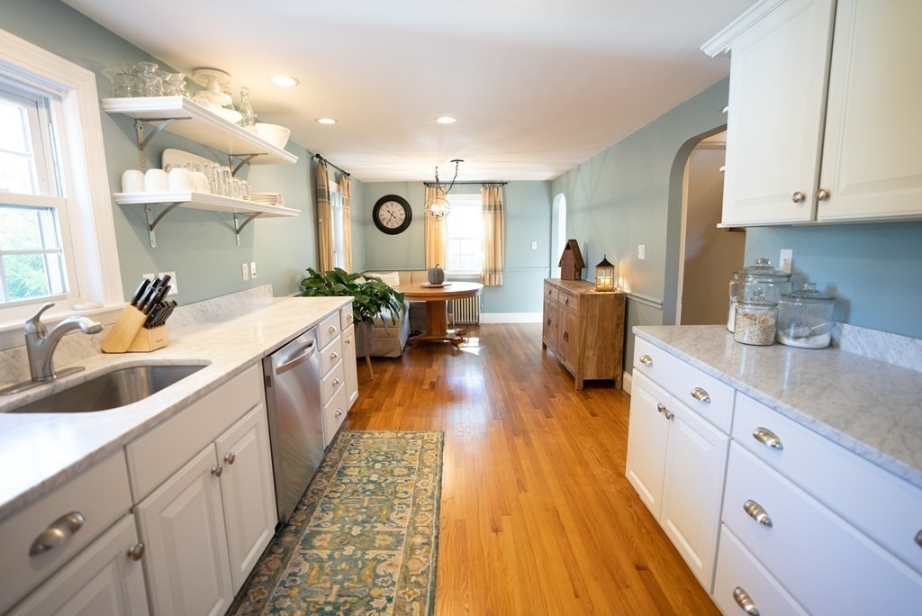 56 Bellows Circle Abington, MA 02351 - Photo 7 of 42 a large white kitchen with sink and dishwasher