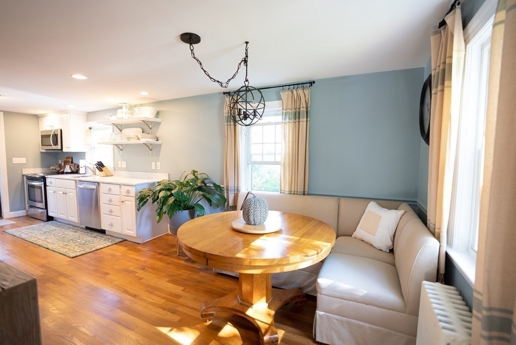 56 Bellows Circle Abington, MA 02351 - Photo 9 of 42 a kitchen with a table and chairs in it