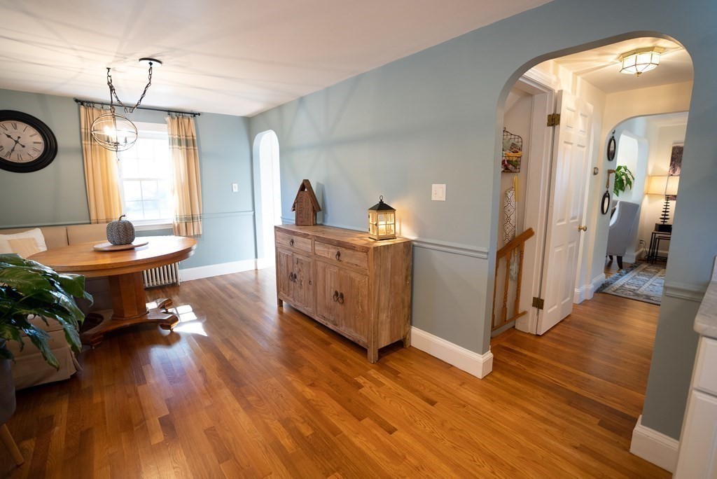 56 Bellows Circle Abington, MA 02351 - Photo 10 of 42 a living room with furniture and a wooden floor