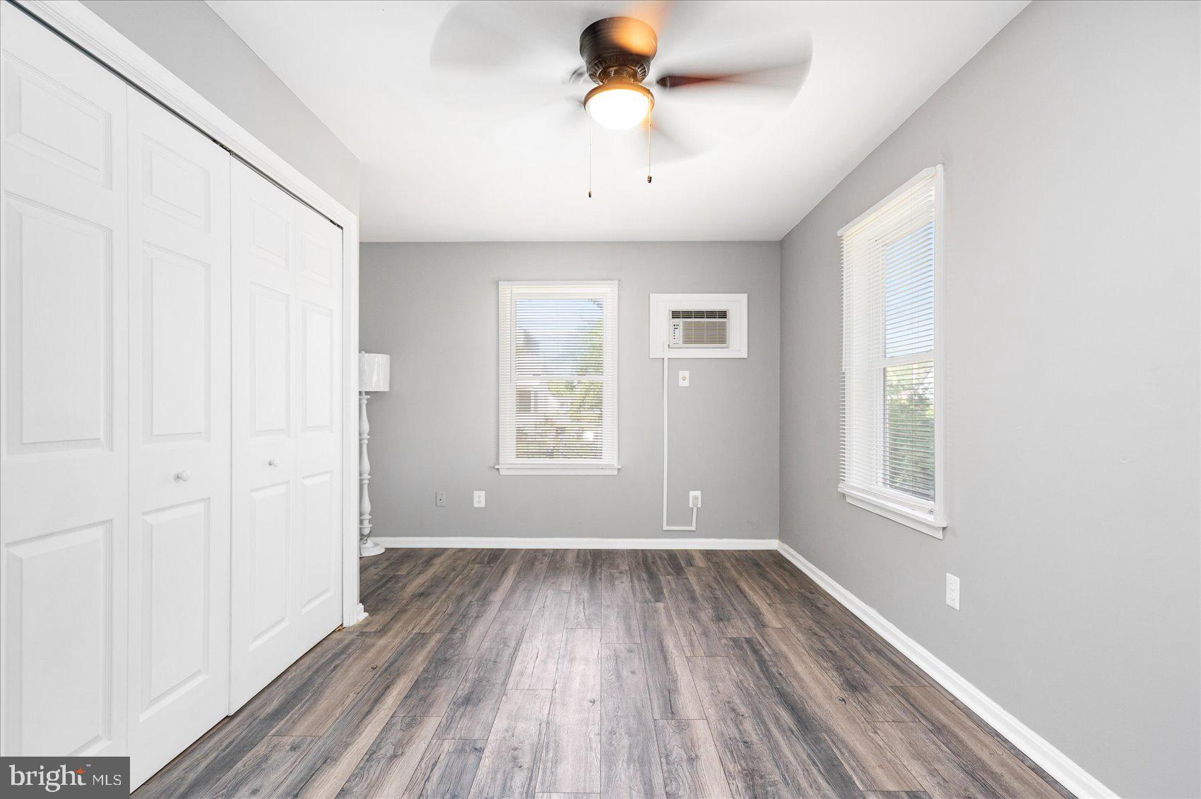 303 Miles Road Essex, MD 21221 - Photo 21 of 37 a view of an empty room with wooden floor and a window