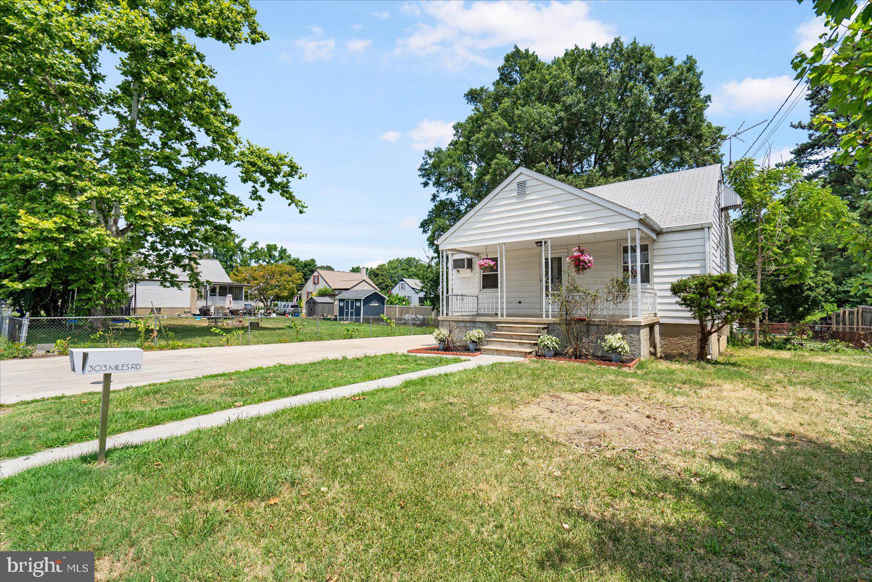303 Miles Road Essex, MD 21221 - Photo 3 of 37 a view of a house with a yard