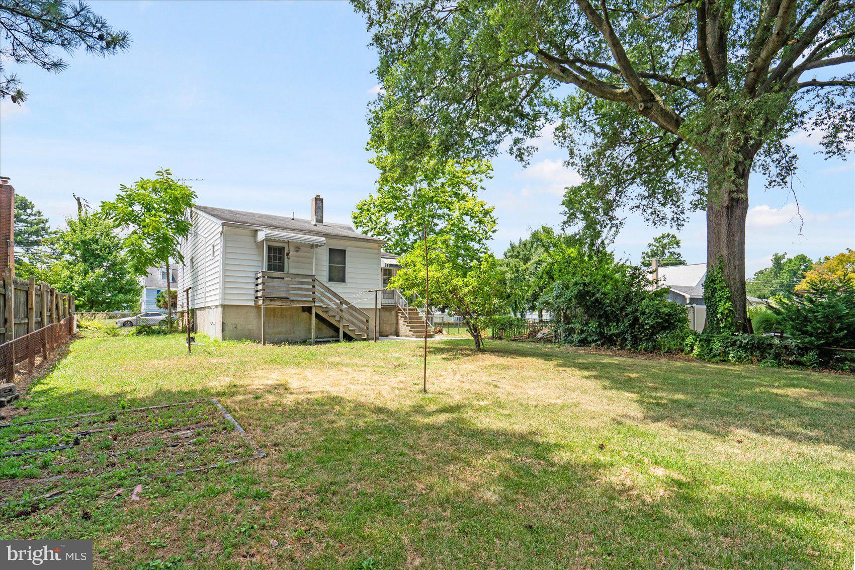 303 Miles Road Essex, MD 21221 - Photo 35 of 37 a house with trees in the background