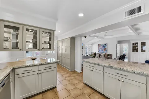 a bathroom with a granite countertop sink mirror and