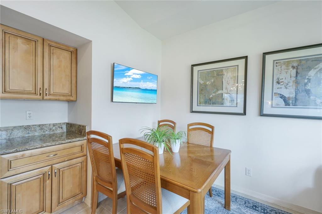 437 Wiggins Lake Court, Unit 201 Naples, FL 34110 - Photo 11 of 24 a view of a workspace with furniture