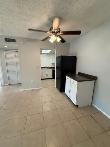 a kitchen with a cabinets and a stove top oven