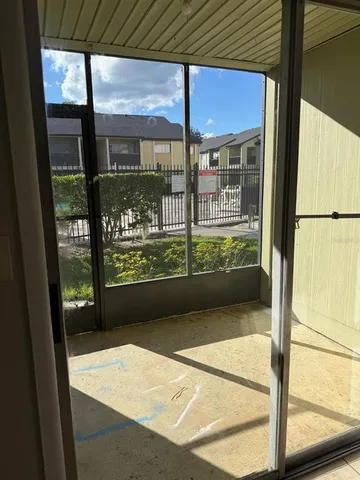 a view of a room with a large window