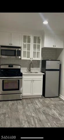 a kitchen with a stove and a microwave
