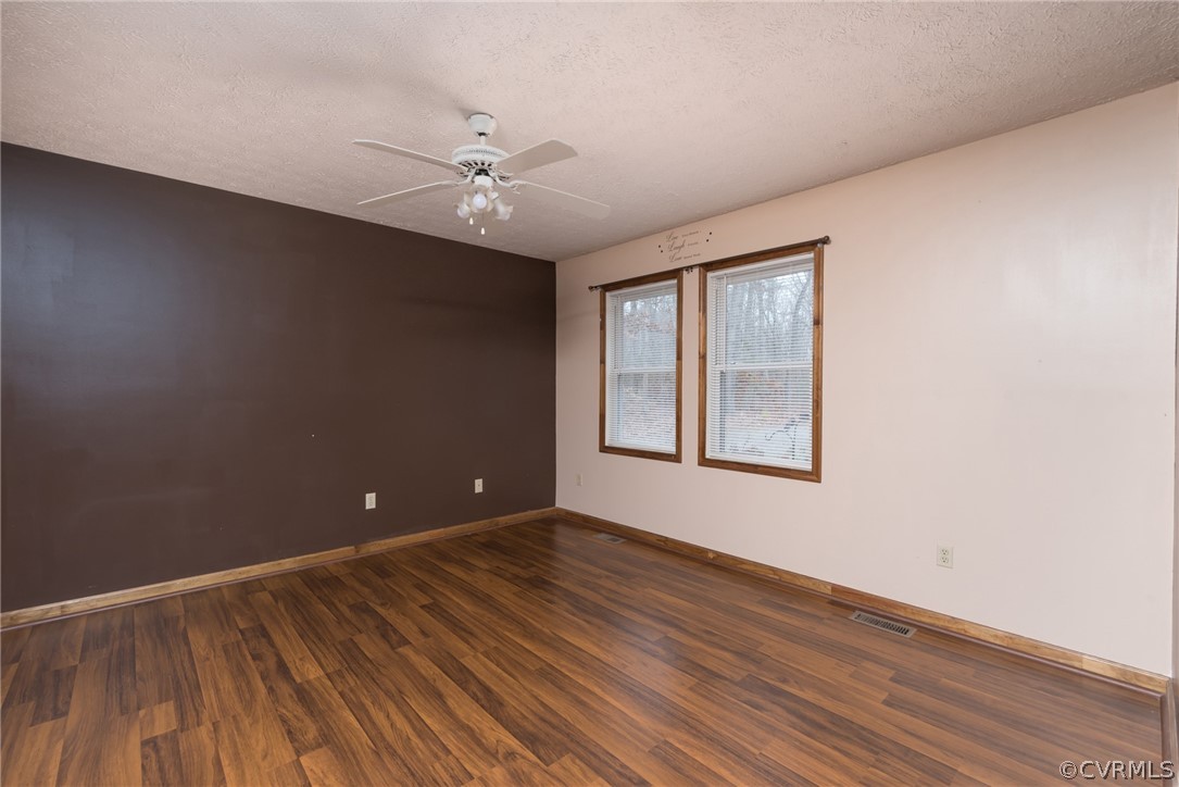 2709 Wickham Road Bumpass, VA 23024 - Photo 18 of 25 wooden floor in an empty room with a window