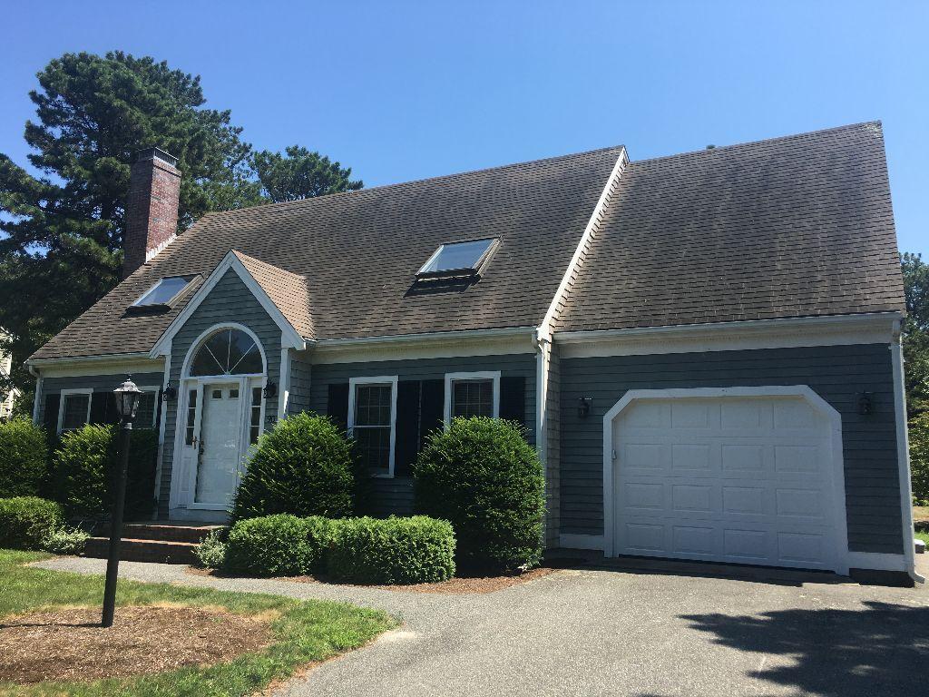 90 Meadowbrook Road Mashpee, MA 02649 - Photo 1 of 32 a front view of a house with garden