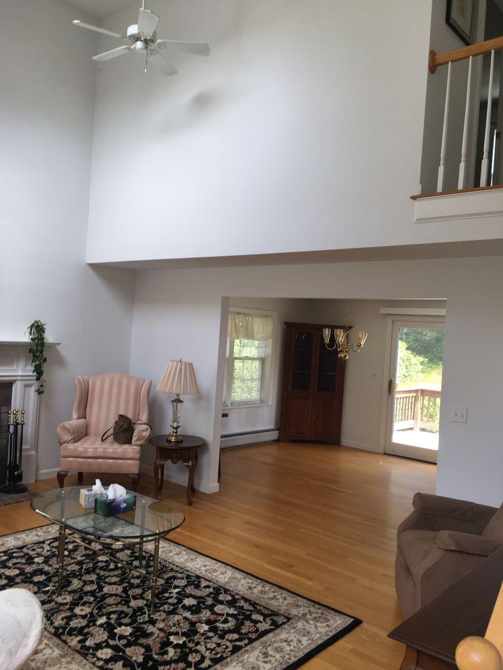 90 Meadowbrook Road Mashpee, MA 02649 - Photo 16 of 32 a living room with furniture and a rug