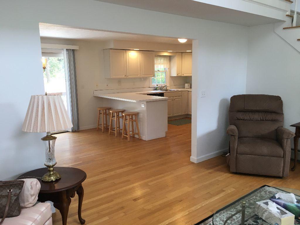90 Meadowbrook Road Mashpee, MA 02649 - Photo 28 of 32 a living room with furniture and a wooden floor