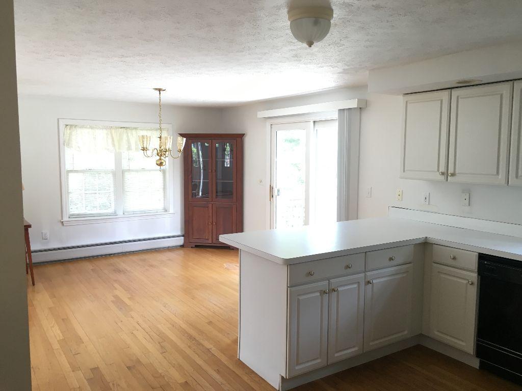 90 Meadowbrook Road Mashpee, MA 02649 - Photo 6 of 32 a kitchen with a sink cabinets and wooden floor