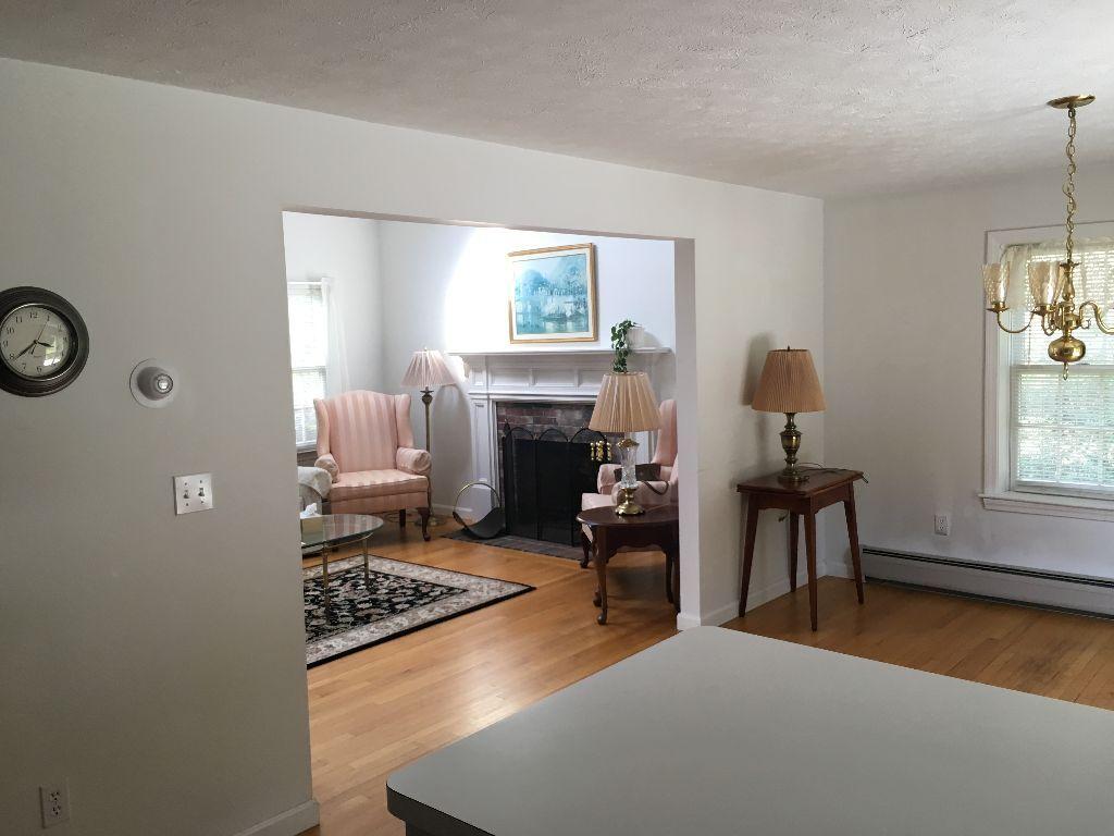 90 Meadowbrook Road Mashpee, MA 02649 - Photo 7 of 32 a living room with furniture and a fireplace