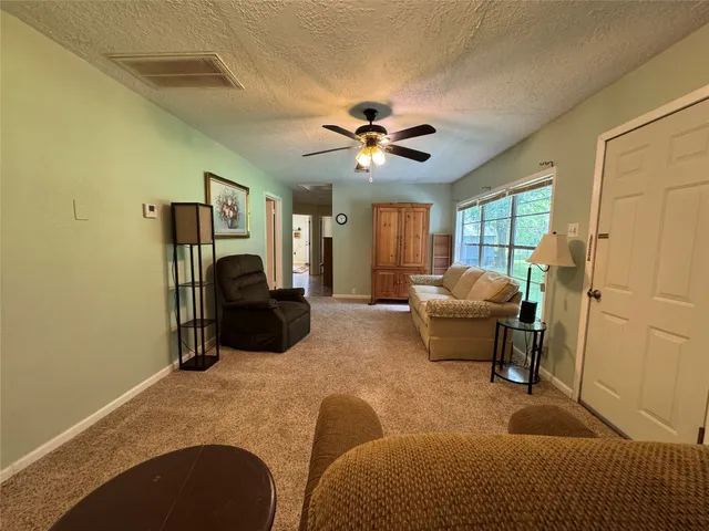 a bedroom with furniture and a chandelier