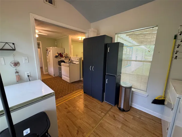 a kitchen with a sink appliances and cabinets