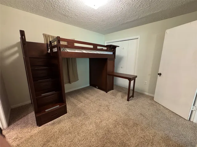 a view of room with furniture and a ceiling fan