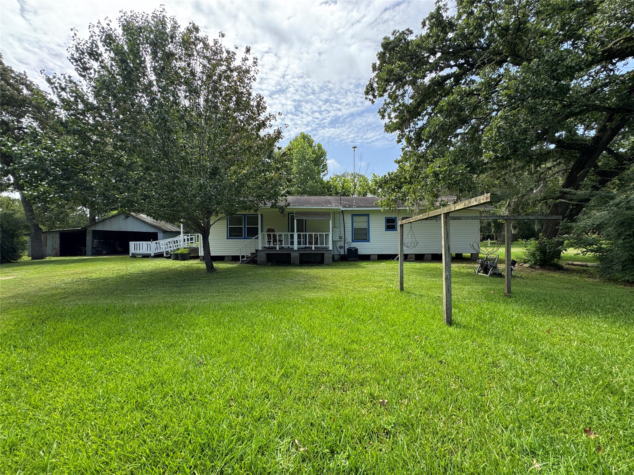2300 Bowler Road Waller, TX 77484 - Photo 31 of 34 a view of a house with a yard porch and sitting area