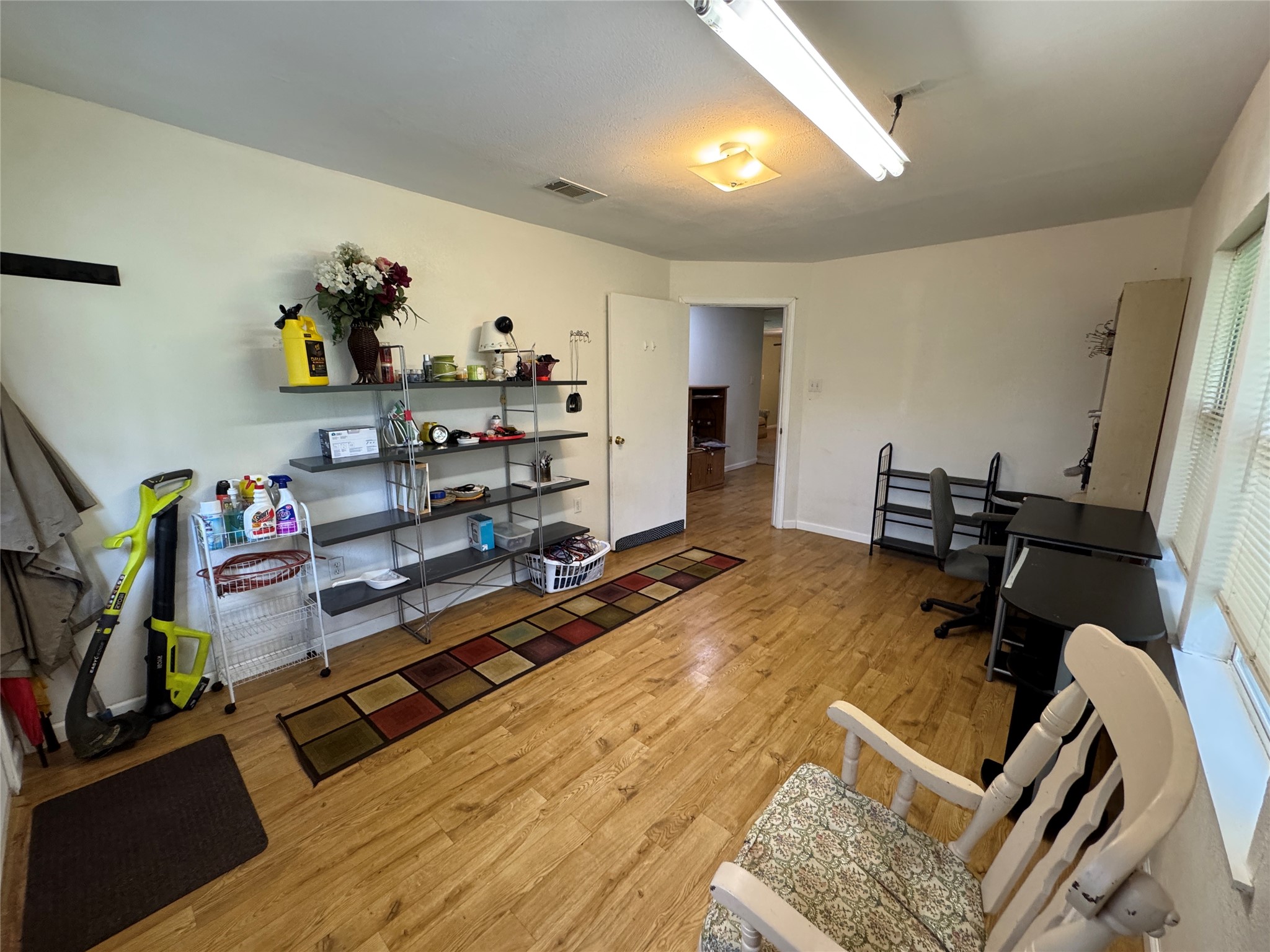 2300 Bowler Road Waller, TX 77484 - Photo 7 of 34 a bedroom with furniture and a wooden floor