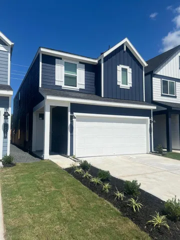 a front view of a house with yard